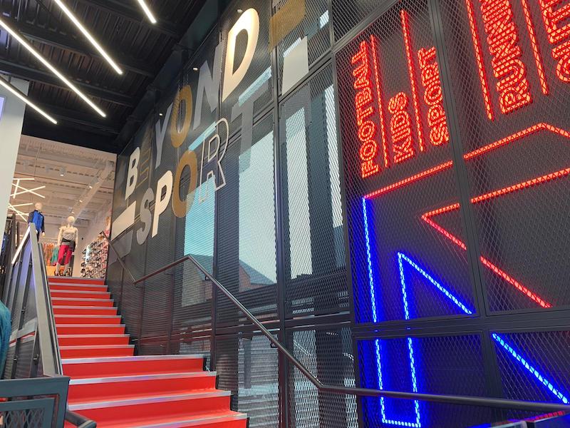 Red retail staircase with neon lighting